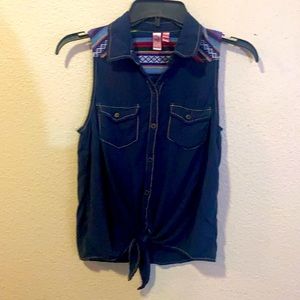 Sleeveless blue blouse with multi colored print